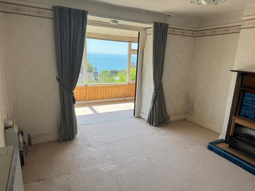 Lot: 147 - COTTAGE FOR IMPROVEMENT WITH SEA VIEWS - Looking From the Living Room Towards the Sun Lounge
